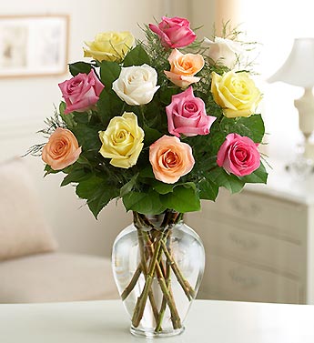 12 Mixed Coloured Roses In A Vase