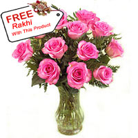 12 Pink Roses In A Vase With A Free Rakhi.