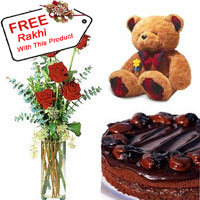 6 Red Roses In A Vase, Half Kg Chocolate Cake, Medium Size Cute Teddy Bear With A Free Rakhi.